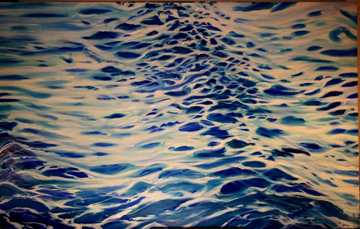 Interlocking blue and pale gold ripples fill the surface of the water.